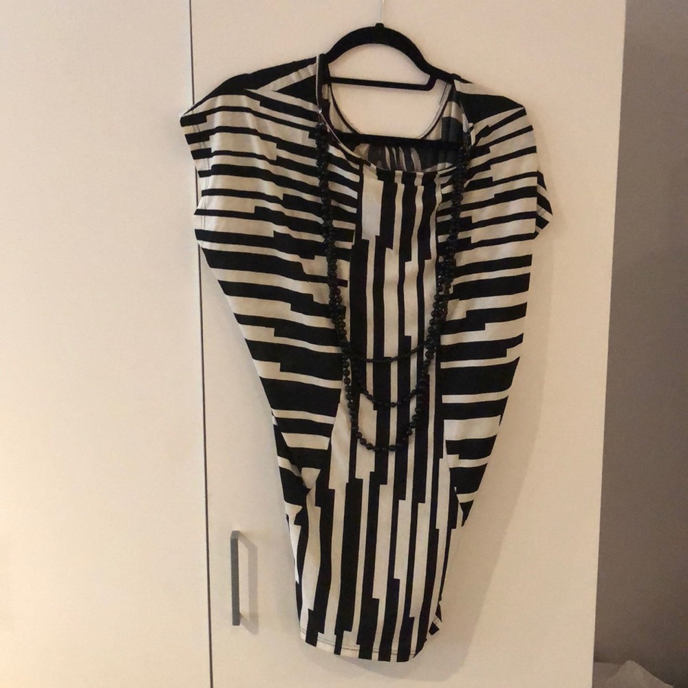 Top with black necklace